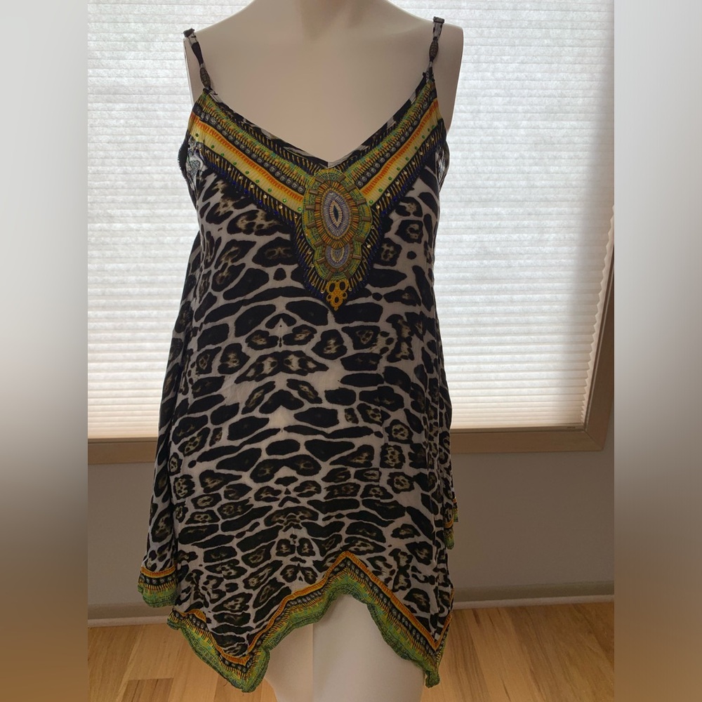Women’s Top. Size: S/M. Good condition. Black/Green/white/orange/ yellow